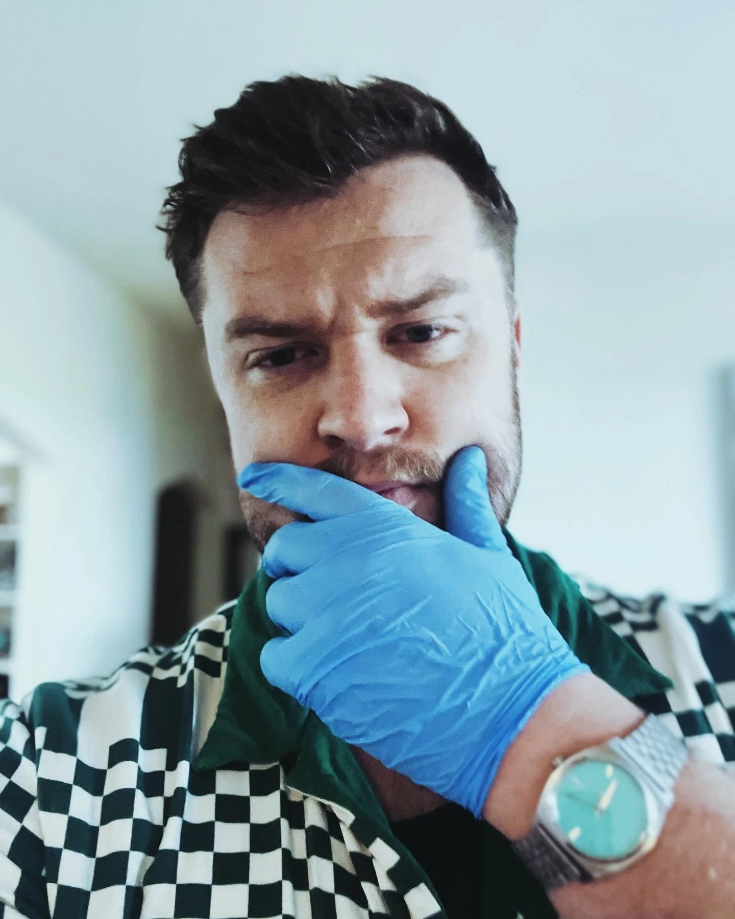 Luc Carlin (LMC): Close-up portrait wearing a blue glove